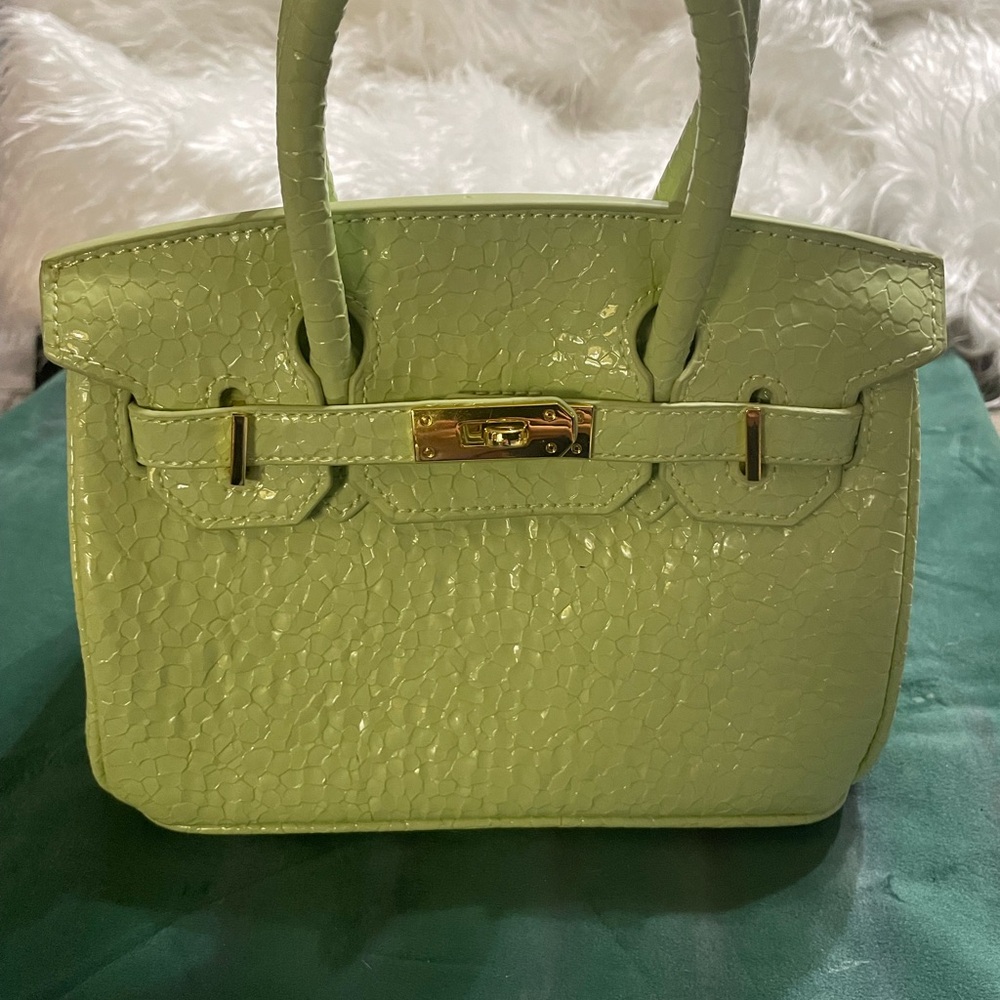 Green Textured Women's Handbag comes with lock and key.NWOT